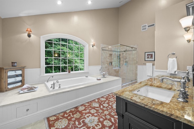 383 Illington Rd, Ossining, NY 10562 - full bath with a shower stall, a wainscoted wall, a bath, vanity, and recessed lighting