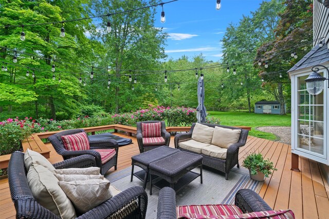383 Illington Rd, Ossining, NY 10562 - wooden deck with an outdoor hangout area, an outbuilding, and a lawn