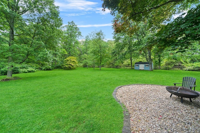 383 Illington Rd, Ossining, NY 10562 - fenced yard with a fire pit and a shed