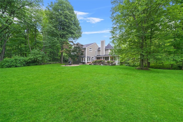 383 Illington Rd, Ossining, NY 10562 - view of grassy yard featuring a patio area
