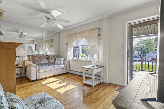1125 Reilly St, Bay Shore, NY 11706 - living area with a baseboard radiator, plenty of natural light, a ceiling fan, crown molding, and light wood-style floors