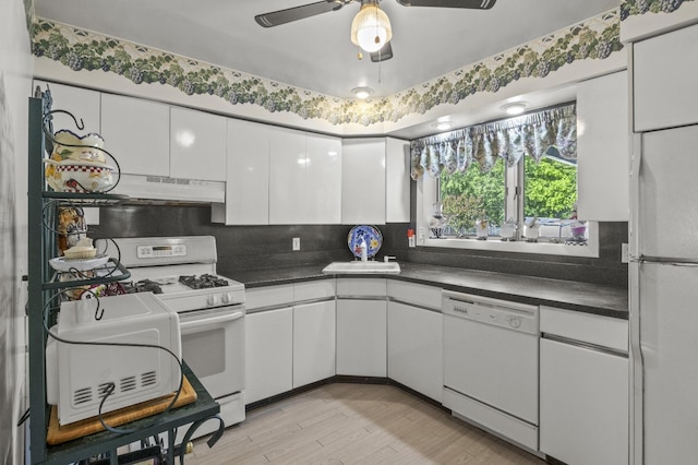 1125 Reilly St, Bay Shore, NY 11706 - kitchen featuring white appliances, white cabinetry, dark countertops, a ceiling fan, and decorative backsplash