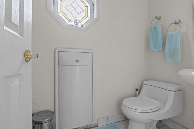 1125 Reilly St, Bay Shore, NY 11706 - bathroom featuring toilet and tile patterned floors