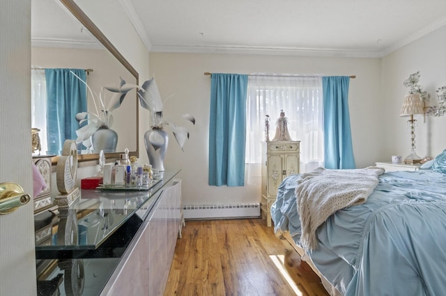 1125 Reilly St, Bay Shore, NY 11706 - bedroom with baseboard heating, wood finished floors, and crown molding