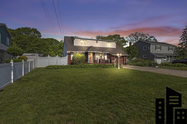 1125 Reilly St, Bay Shore, NY 11706 - colonial inspired home featuring driveway, covered porch, brick siding, and a shingled roof
