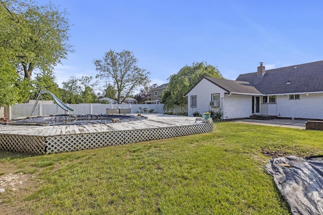 1125 Reilly St, Bay Shore, NY 11706 - view of yard featuring a wooden deck