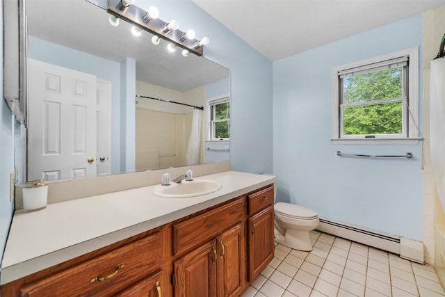 14 Cheesecote Ct, Stony Point, NY 10980 - bathroom featuring a baseboard heating unit, tile patterned flooring, vanity, toilet, and healthy amount of natural light