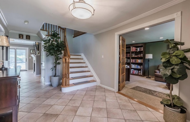 10 Woods Edge Ct, Hauppauge, NY 11788 - stairway with crown molding, tile patterned flooring, and baseboards
