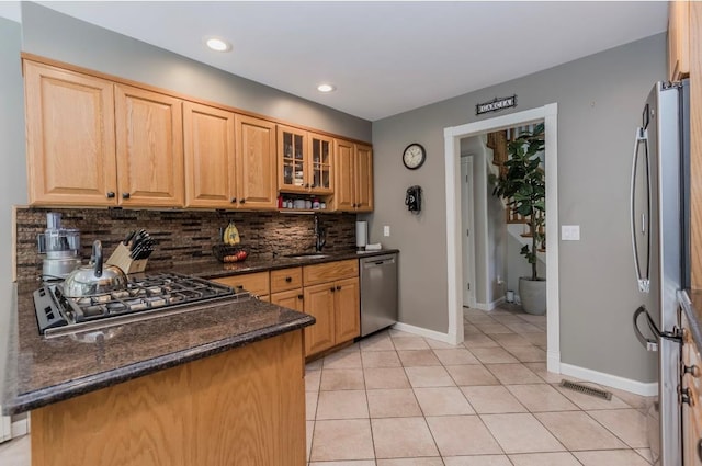 10 Woods Edge Ct, Hauppauge, NY 11788 - kitchen with appliances with stainless steel finishes, decorative backsplash, baseboards, a sink, and glass insert cabinets