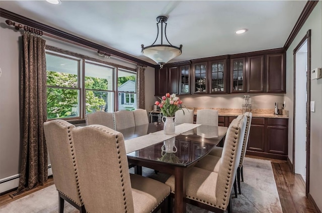 10 Woods Edge Ct, Hauppauge, NY 11788 - dining area featuring light wood-style floors, recessed lighting, and ornamental molding