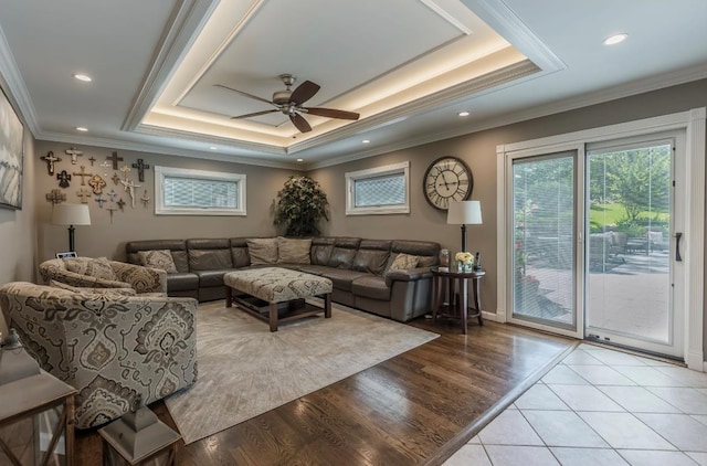 10 Woods Edge Ct, Hauppauge, NY 11788 - living area with a tray ceiling, ceiling fan, ornamental molding, wood finished floors, and recessed lighting