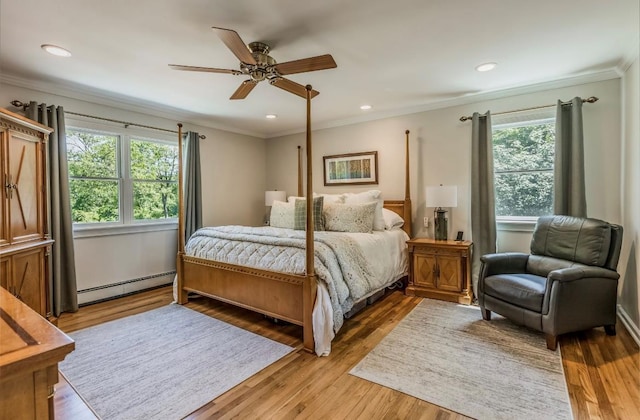 10 Woods Edge Ct, Hauppauge, NY 11788 - bedroom featuring a baseboard heating unit, ornamental molding, light wood-style floors, recessed lighting, and ceiling fan