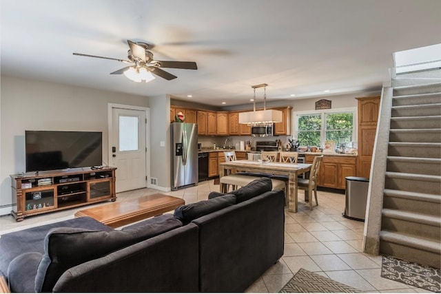 10 Woods Edge Ct, Hauppauge, NY 11788 - living area with light tile patterned floors, stairs, a ceiling fan, recessed lighting, and baseboard heating