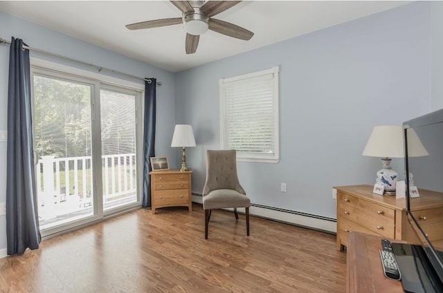 10 Woods Edge Ct, Hauppauge, NY 11788 - sitting room with a ceiling fan, baseboard heating, and wood finished floors