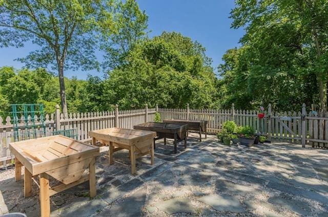 10 Woods Edge Ct, Hauppauge, NY 11788 - view of patio / terrace featuring view of wooded area