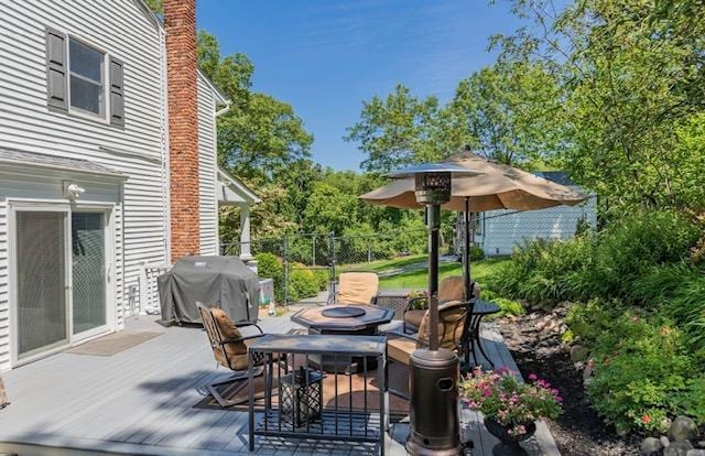 10 Woods Edge Ct, Hauppauge, NY 11788 - wooden deck with area for grilling and outdoor dining space