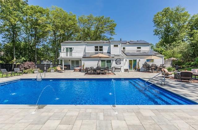 10 Woods Edge Ct, Hauppauge, NY 11788 - view of swimming pool featuring a patio and outdoor dining area