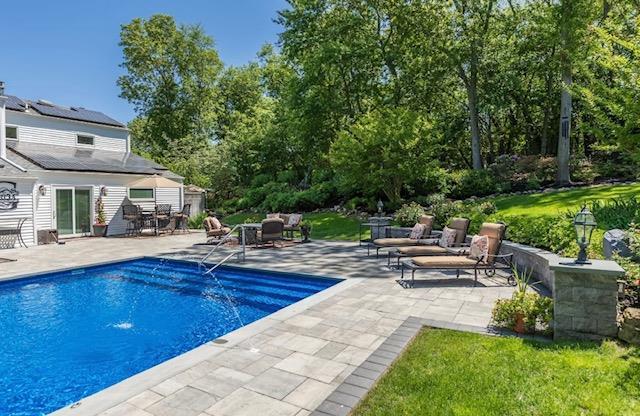 10 Woods Edge Ct, Hauppauge, NY 11788 - swimming pool featuring a patio area
