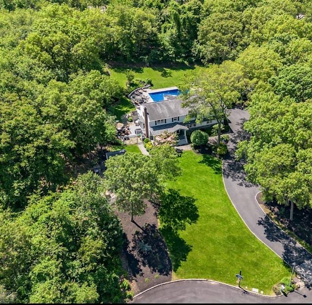 10 Woods Edge Ct, Hauppauge, NY 11788 - view from above of property with a forest