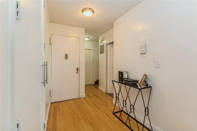 12399 Flatlands Ave Unit 7C, Brooklyn, NY 11207 - hallway featuring light wood-style floors and baseboards