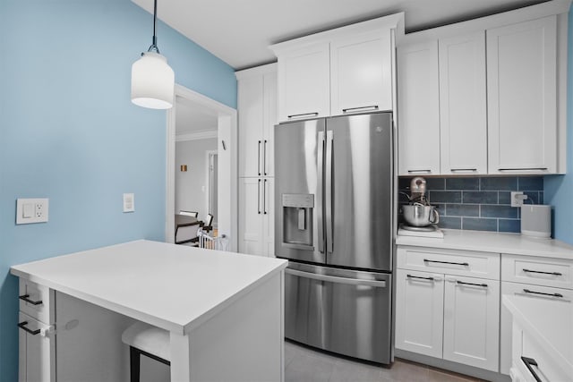 295 N Broadway Unit 27, Yonkers, NY 10701 - kitchen featuring stainless steel refrigerator with ice dispenser, light countertops, white cabinetry, pendant lighting, and tasteful backsplash