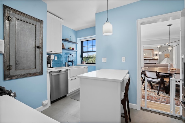 295 N Broadway Unit 27, Yonkers, NY 10701 - kitchen with stainless steel dishwasher, white cabinetry, open shelves, and tasteful backsplash