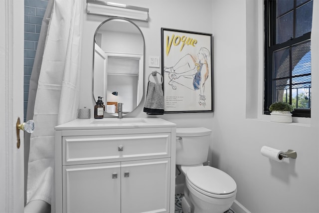 295 N Broadway Unit 27, Yonkers, NY 10701 - full bathroom featuring toilet, vanity, a shower with curtain, and baseboards