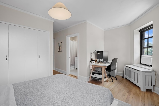 295 N Broadway Unit 27, Yonkers, NY 10701 - bedroom with ornamental molding, light wood-style floors, baseboards, cooling unit, and a closet