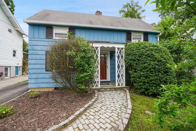 329 Simpson Pl, Peekskill, NY 10566 - view of front of property featuring a chimney and board and batten siding