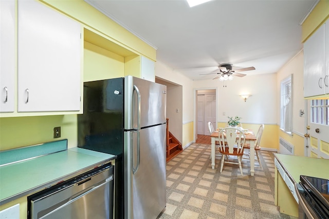 329 Simpson Pl, Peekskill, NY 10566 - kitchen with stainless steel appliances, light countertops, a ceiling fan, light flooring, and white cabinets