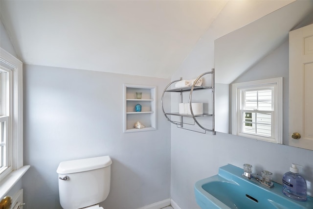 329 Simpson Pl, Peekskill, NY 10566 - half bathroom featuring vaulted ceiling and built in features