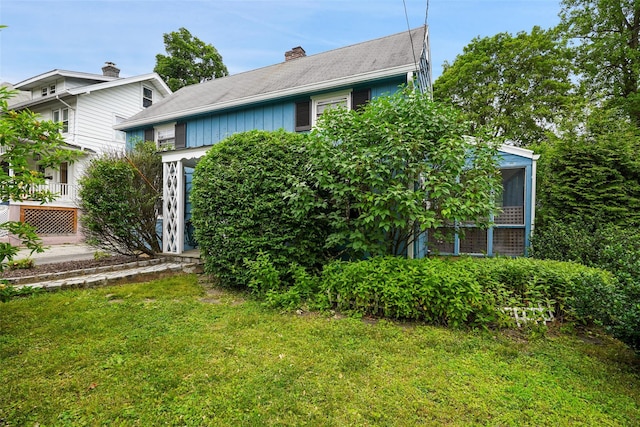 329 Simpson Pl, Peekskill, NY 10566 - view of front of property featuring a front lawn and a chimney