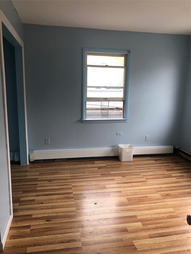 19 Wawayanda Ave, Middletown, NY 10940 - empty room featuring wood finished floors and a baseboard radiator