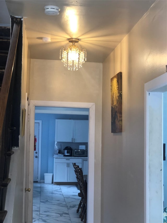 19 Wawayanda Ave, Middletown, NY 10940 - hallway with light marble finish flooring and a chandelier