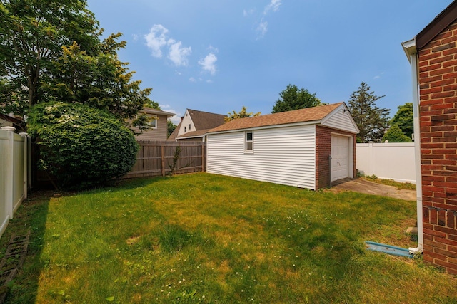 2430 Loft Ave, Baldwin, NY 11510 - fenced backyard with an outbuilding, a garage, and driveway