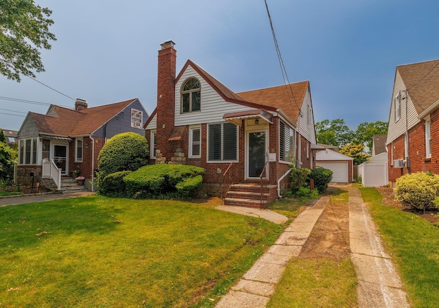 2430 Loft Ave, Baldwin, NY 11510 - view of front of property featuring a garage, a front yard, brick siding, an outdoor structure, and a chimney