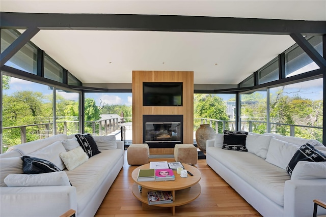 490 Tarpon Walk, Fire Island Pines, NY 11782 - sunroom featuring plenty of natural light, wood finished floors, lofted ceiling, and expansive windows