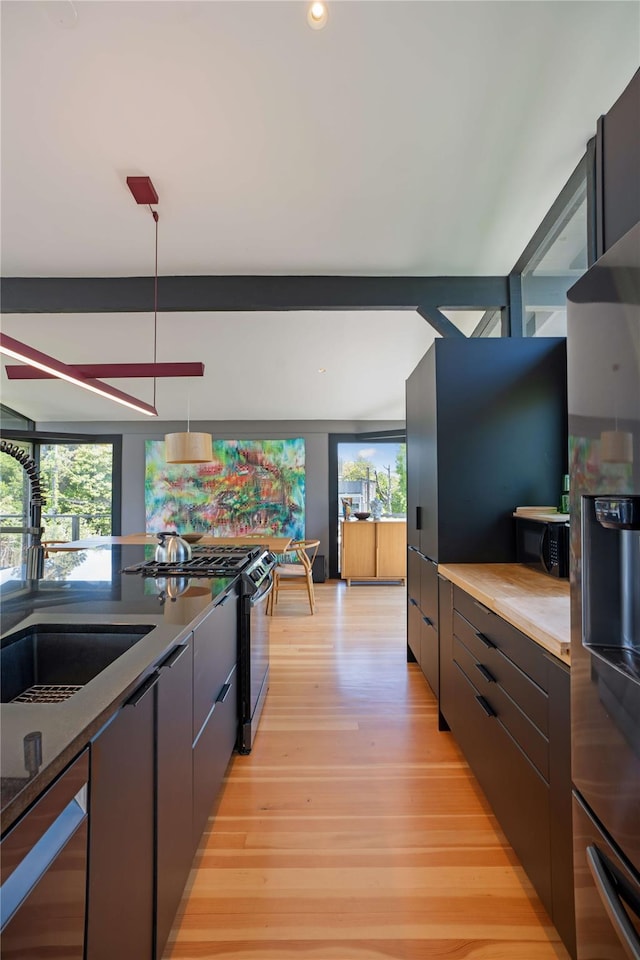 490 Tarpon Walk, Fire Island Pines, NY 11782 - kitchen featuring gas stove, a sink, healthy amount of natural light, stainless steel fridge, and recessed lighting