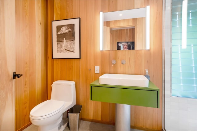 490 Tarpon Walk, Fire Island Pines, NY 11782 - bathroom with toilet, wood walls, and baseboards
