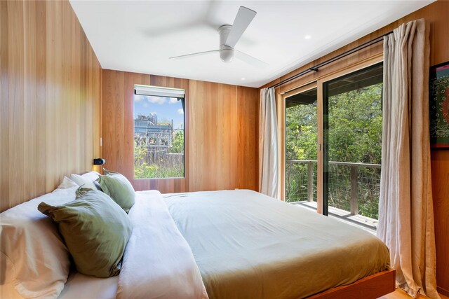 490 Tarpon Walk, Fire Island Pines, NY 11782 - bedroom featuring wood walls and ceiling fan