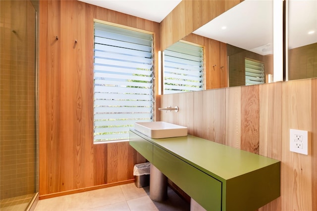 490 Tarpon Walk, Fire Island Pines, NY 11782 - bathroom with a shower stall, healthy amount of natural light, vanity, tile patterned floors, and wooden walls