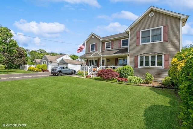 2976 Ruth Rd, Wantagh, NY 11793 - view of front of house with covered porch, a front lawn, and driveway