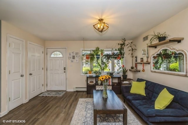 2976 Ruth Rd, Wantagh, NY 11793 - living room featuring wood finished floors, healthy amount of natural light, a baseboard radiator, and baseboards