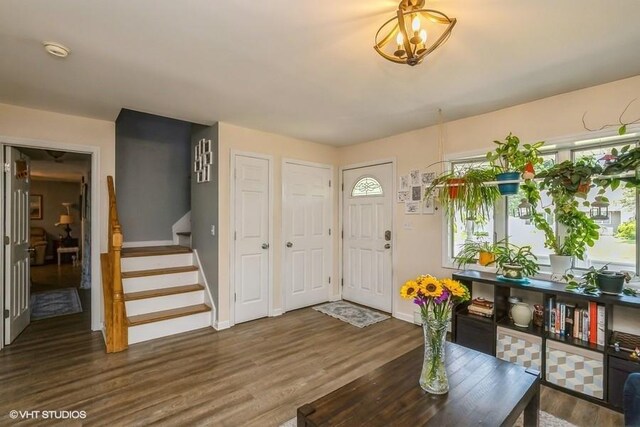 2976 Ruth Rd, Wantagh, NY 11793 - foyer entrance with baseboards, wood finished floors, and stairs