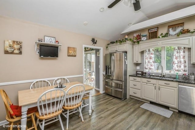 2976 Ruth Rd, Wantagh, NY 11793 - kitchen featuring appliances with stainless steel finishes, a sink, ceiling fan, vaulted ceiling, and wood finished floors