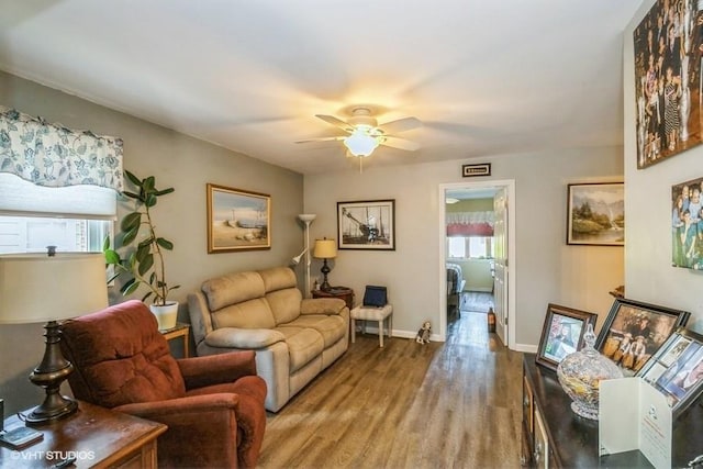 2976 Ruth Rd, Wantagh, NY 11793 - living area featuring wood finished floors, a ceiling fan, and baseboards