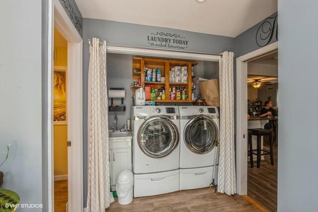 2976 Ruth Rd, Wantagh, NY 11793 - laundry room featuring separate washer and dryer, wood finished floors, a ceiling fan, and bar