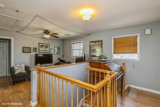 2976 Ruth Rd, Wantagh, NY 11793 - hall with wood finished floors, an upstairs landing, and baseboards