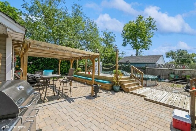 2976 Ruth Rd, Wantagh, NY 11793 - fenced backyard featuring a wooden deck, a pergola, and a patio area