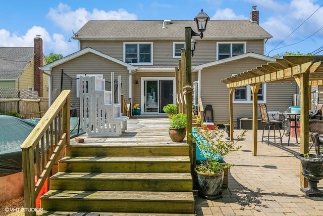 2976 Ruth Rd, Wantagh, NY 11793 - back of house featuring a pergola, a patio area, a wooden deck, and a chimney
